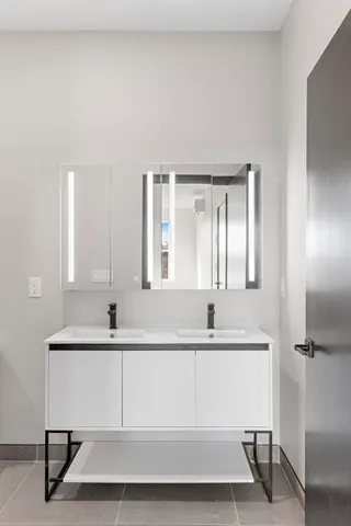 a bathroom with a bathtub sink a mirror and shower
