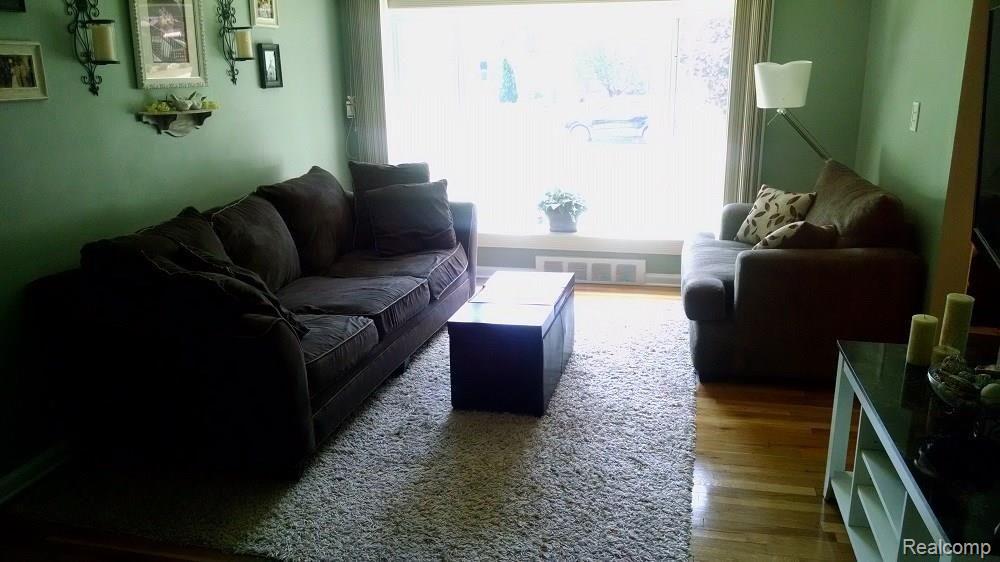 15714 Champaign Road Allen Park, MI 48101 - Photo 14 of 24 LIVING ROOM VIEWED FROM DINING ROOM. FOYER IS ON THE RIGHT.