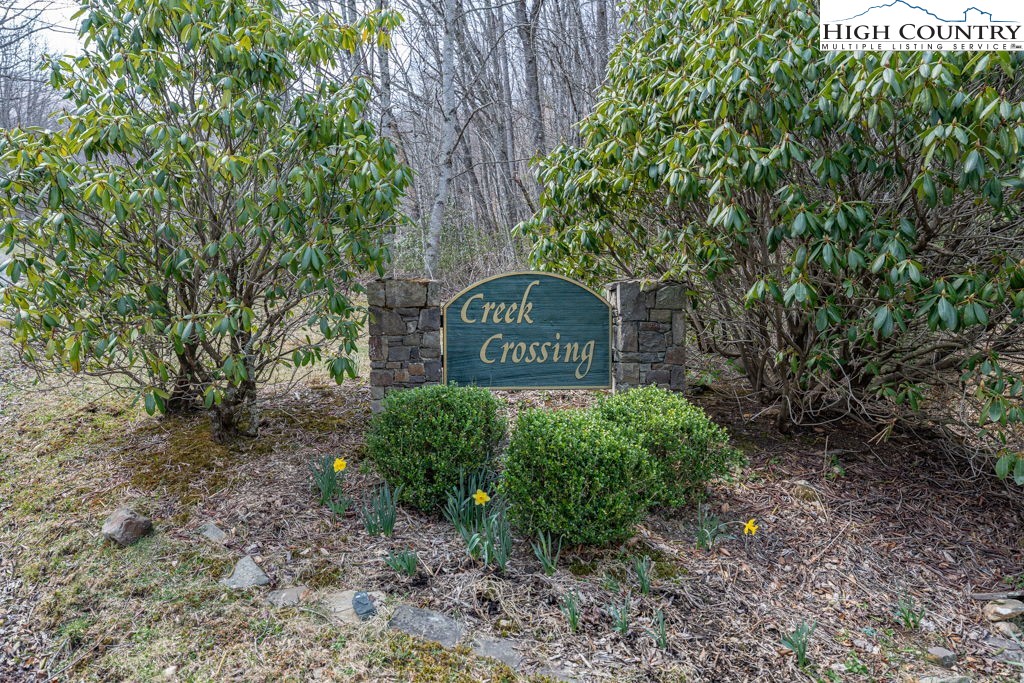 Grande Oaks Drive Todd, NC 28684 - Photo 4 of 34 a sign that is sitting in front of a tree