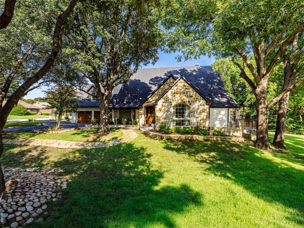 153 Meadowcreek Road Coppell, TX 75019 - Photo 2 of 35 a swimming pool with trees in the background