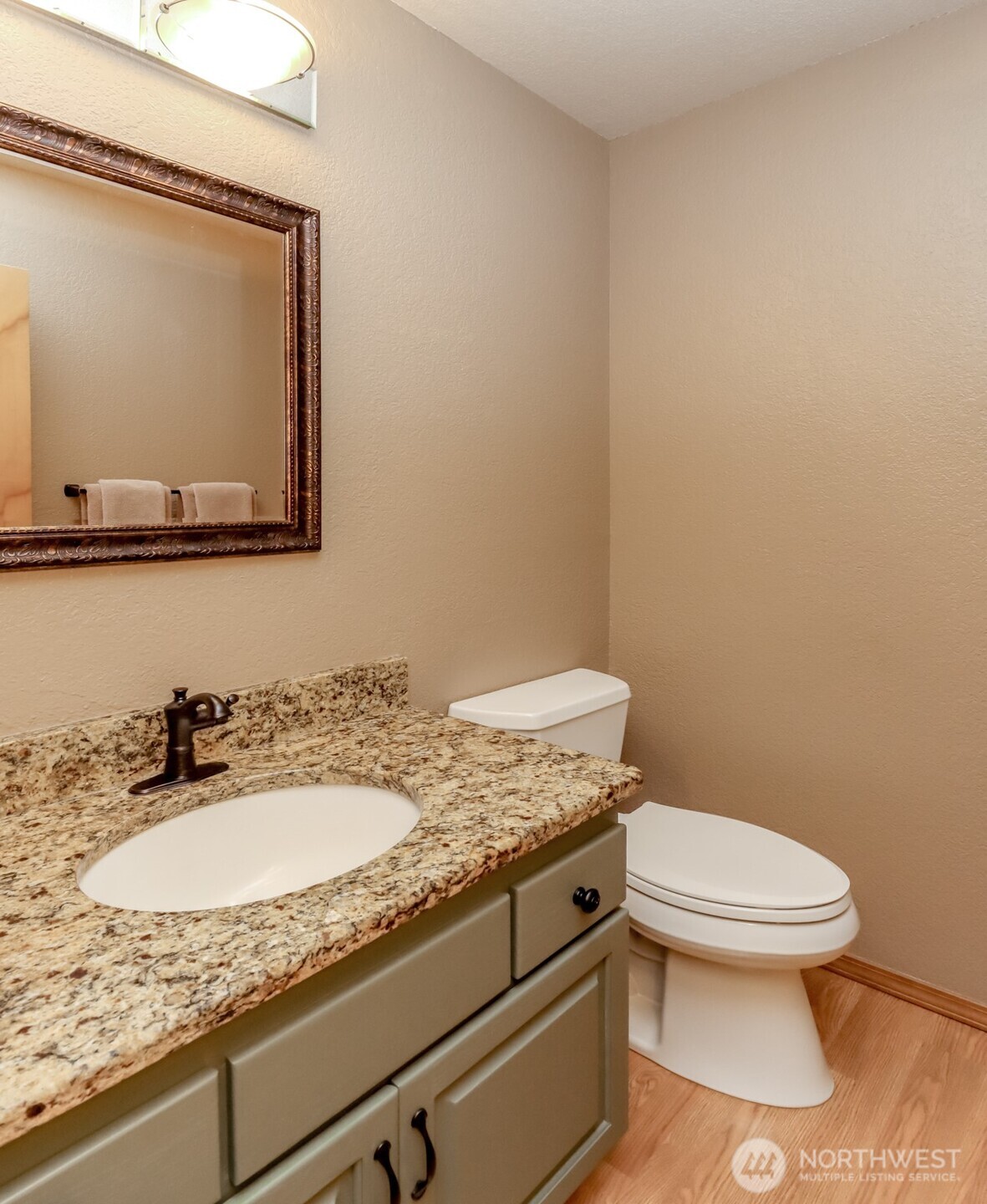 5475 Park Pl Loop Southeast Lacey, WA 98503 - Photo 15 of 40 a bathroom with a granite countertop toilet sink and mirror