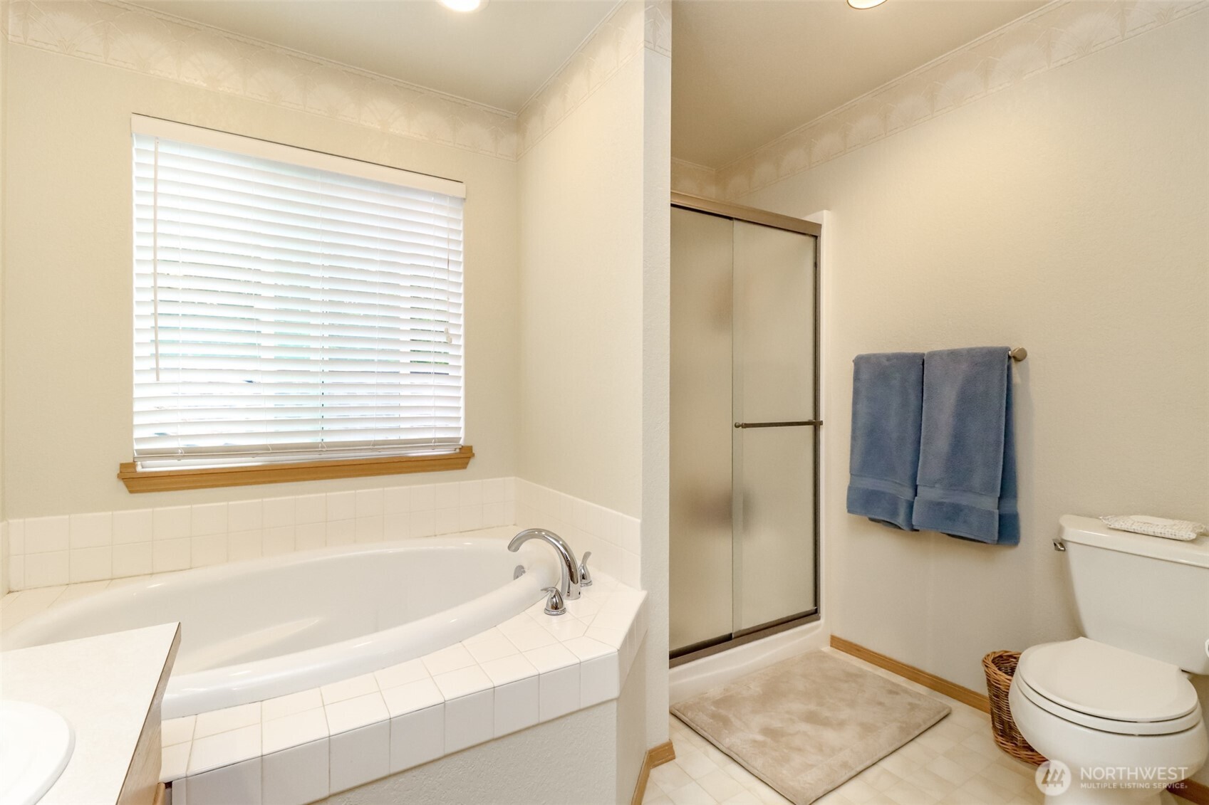 5475 Park Pl Loop Southeast Lacey, WA 98503 - Photo 27 of 40 a bathroom with a bathtub toilet and window