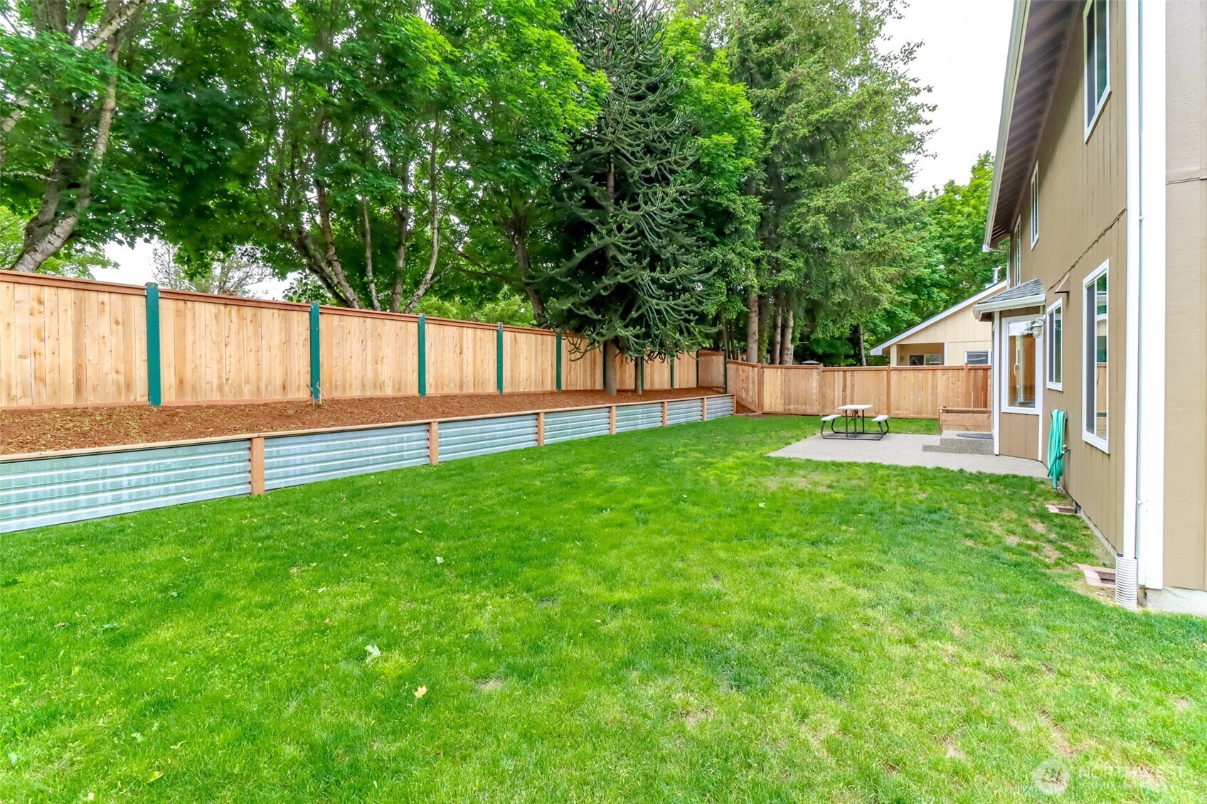 5475 Park Pl Loop Southeast Lacey, WA 98503 - Photo 35 of 40 a view of a backyard with a garden