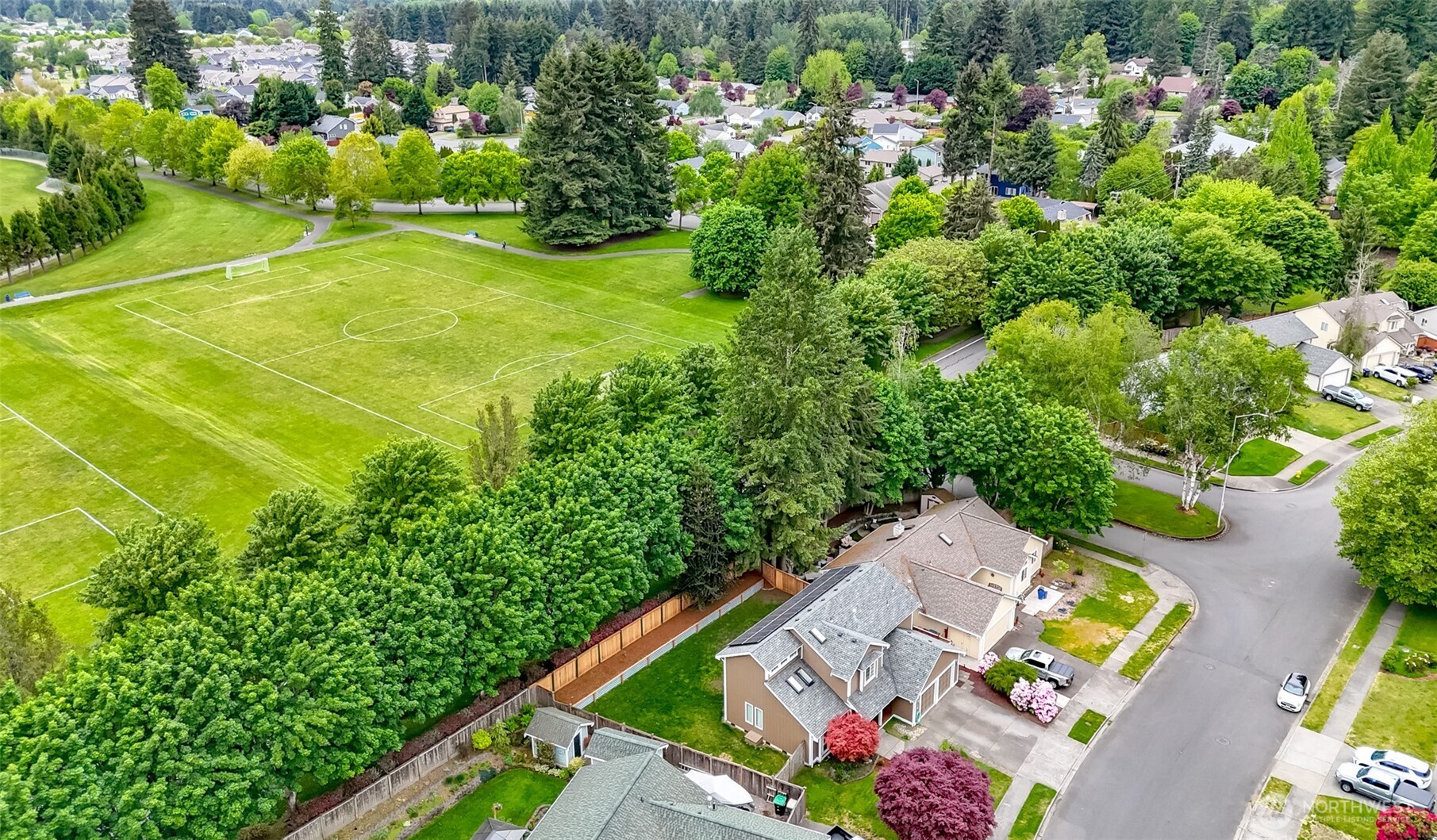 5475 Park Pl Loop Southeast Lacey, WA 98503 - Photo 4 of 40 an aerial view of residential house with outdoor space and trees all around