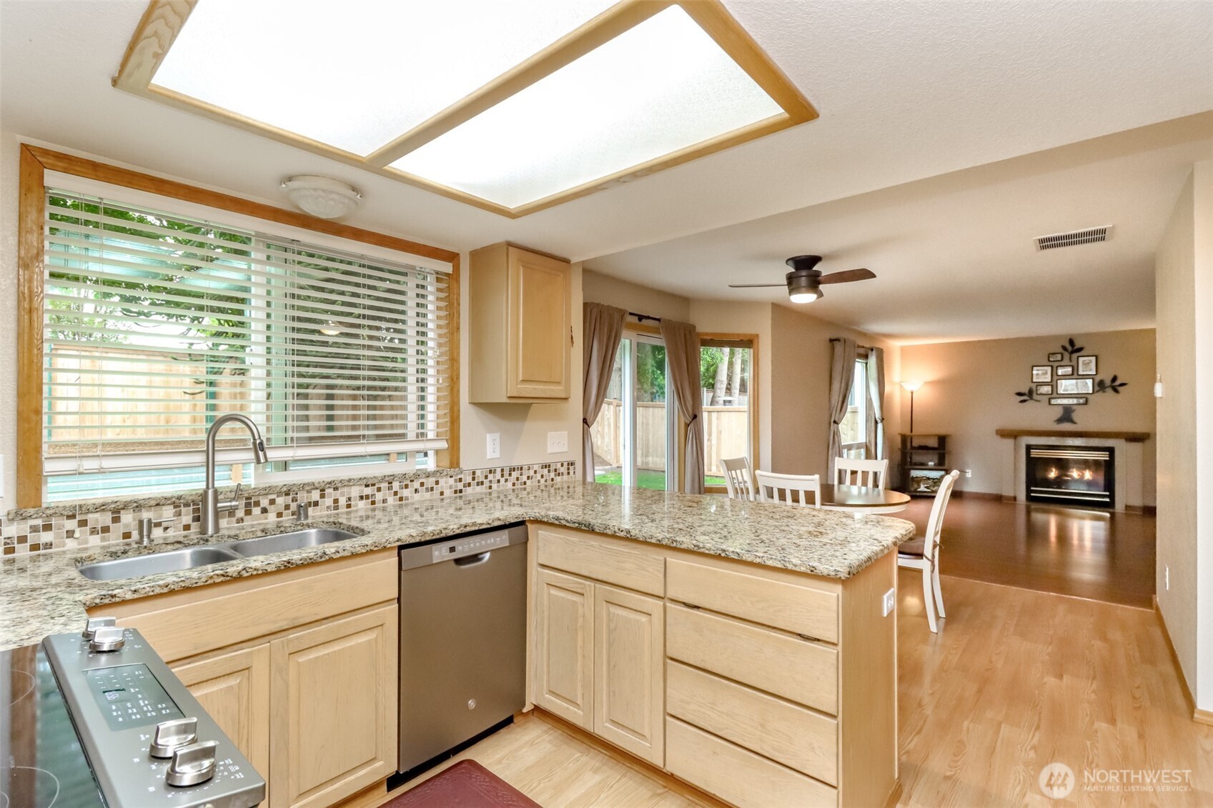 5475 Park Pl Loop Southeast Lacey, WA 98503 - Photo 10 of 40 a kitchen with stainless steel appliances granite countertop sink and cabinets