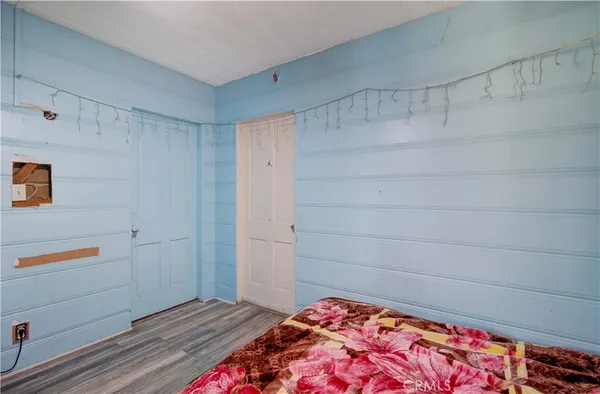 a bedroom with a bed and a walk in closet