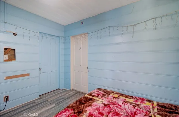 a bedroom with a bed and a walk in closet