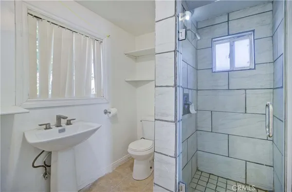 a bedroom with a bed and a bookshelf