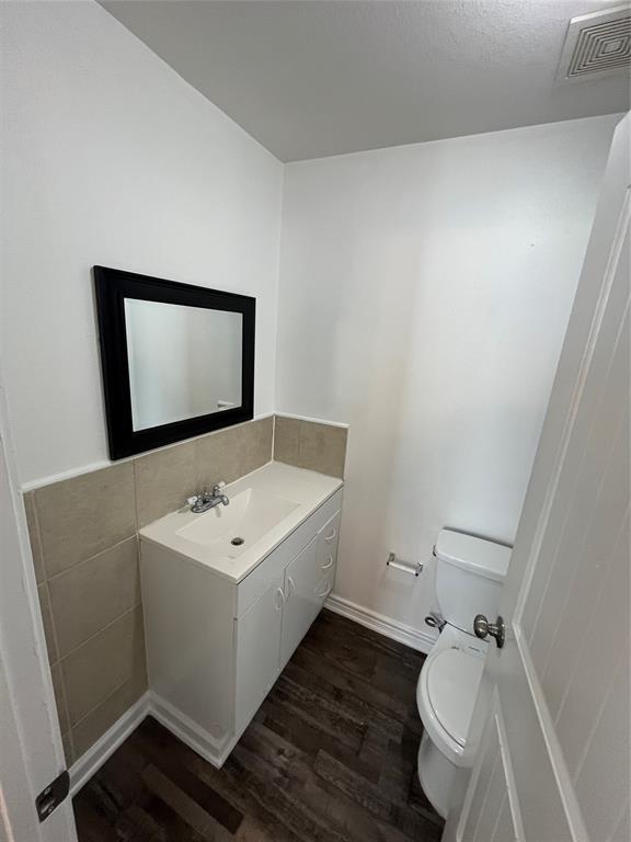 1107 Calle Real Mesquite, TX 75149 - Photo 15 of 24 a bathroom with a toilet sink and mirror