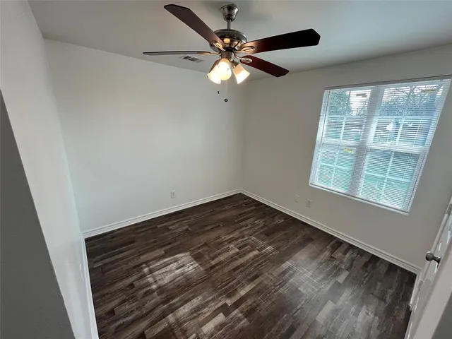 a view of a livingroom with wooden floor