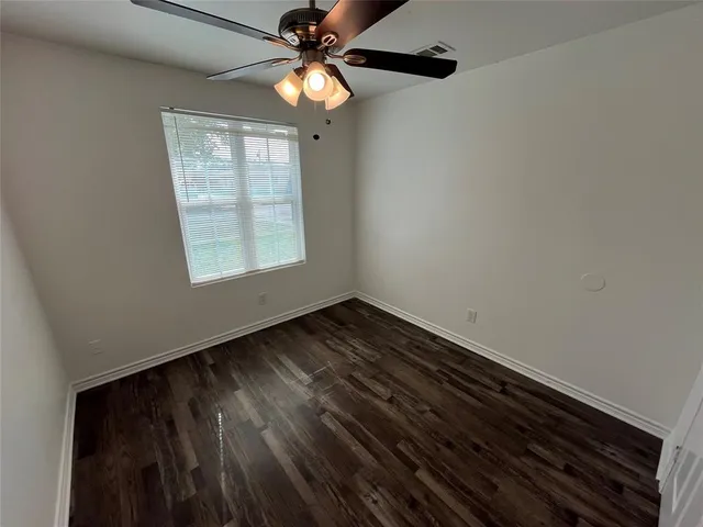 a view of room with hardwood floor