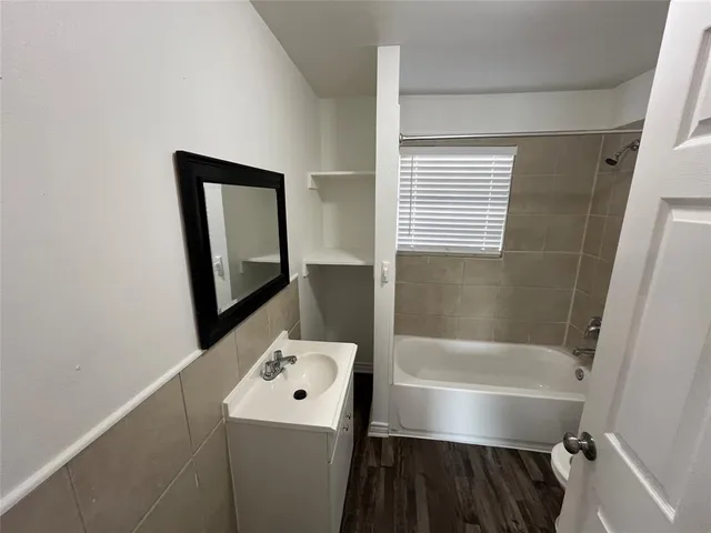 a bathroom with a toilet and a bathtub