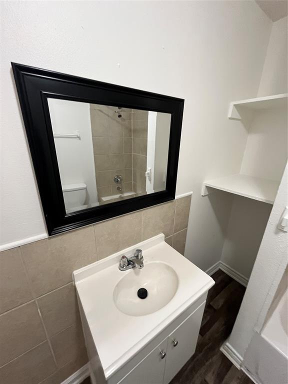 1107 Calle Real Mesquite, TX 75149 - Photo 23 of 24 a bathroom with a sink a mirror and vanity