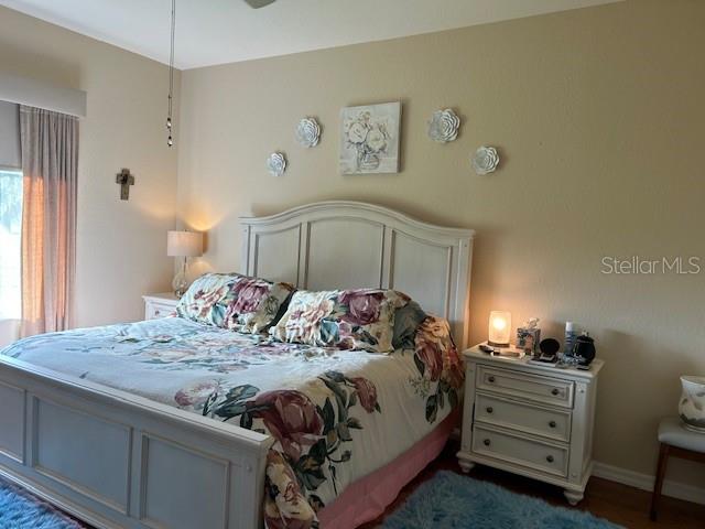 Undisclosed Address Summerfield, FL 34491 - Photo 2 of 12 a bedroom with a bed and a dresser in it
