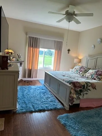 a bed room with a bed and a television