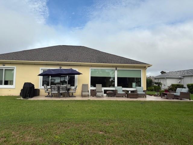 Undisclosed Address Summerfield, FL 34491 - Photo 9 of 12 a front view of house with yard and outdoor seating