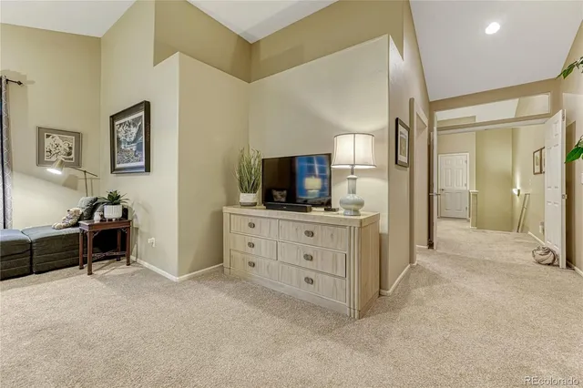 a spacious bathroom with a granite countertop sink a mirror a shower and a bathtub