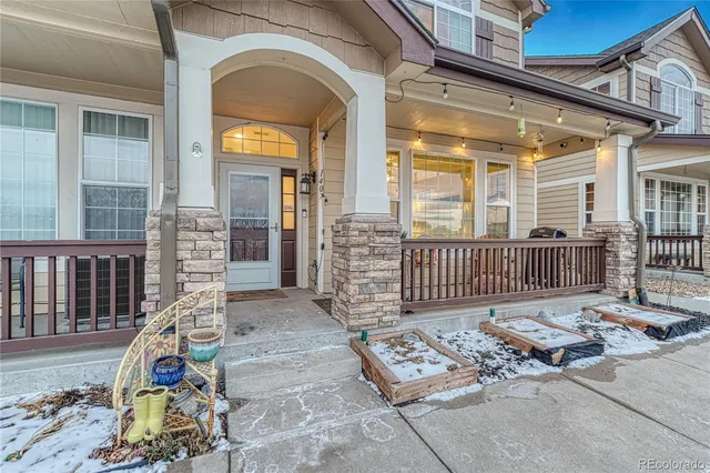 a view of a chair and table in the porch