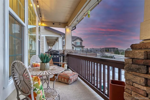 a view of balcony with furniture