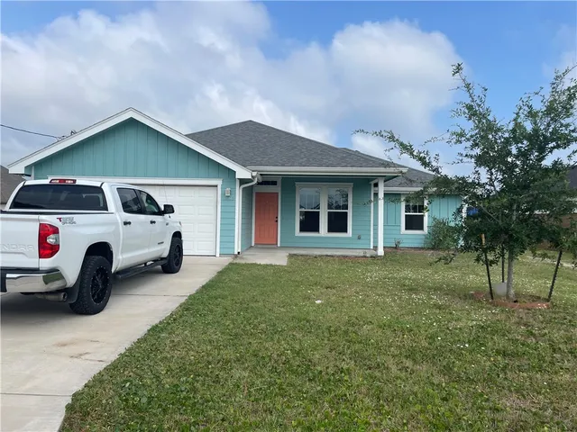 a view of a house with a truck parked