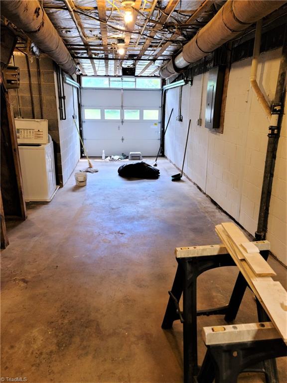 8074 Idols Road Clemmons, NC 27012 - Photo 17 of 21 Interior of basement garage