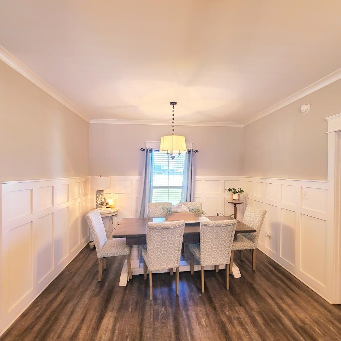 10051 Blackwell Nursery Road Semmes, AL 36575 - Photo 47 of 54 Dining room with a decorative wall, wainscoting, crown molding, and dark wood-style floors