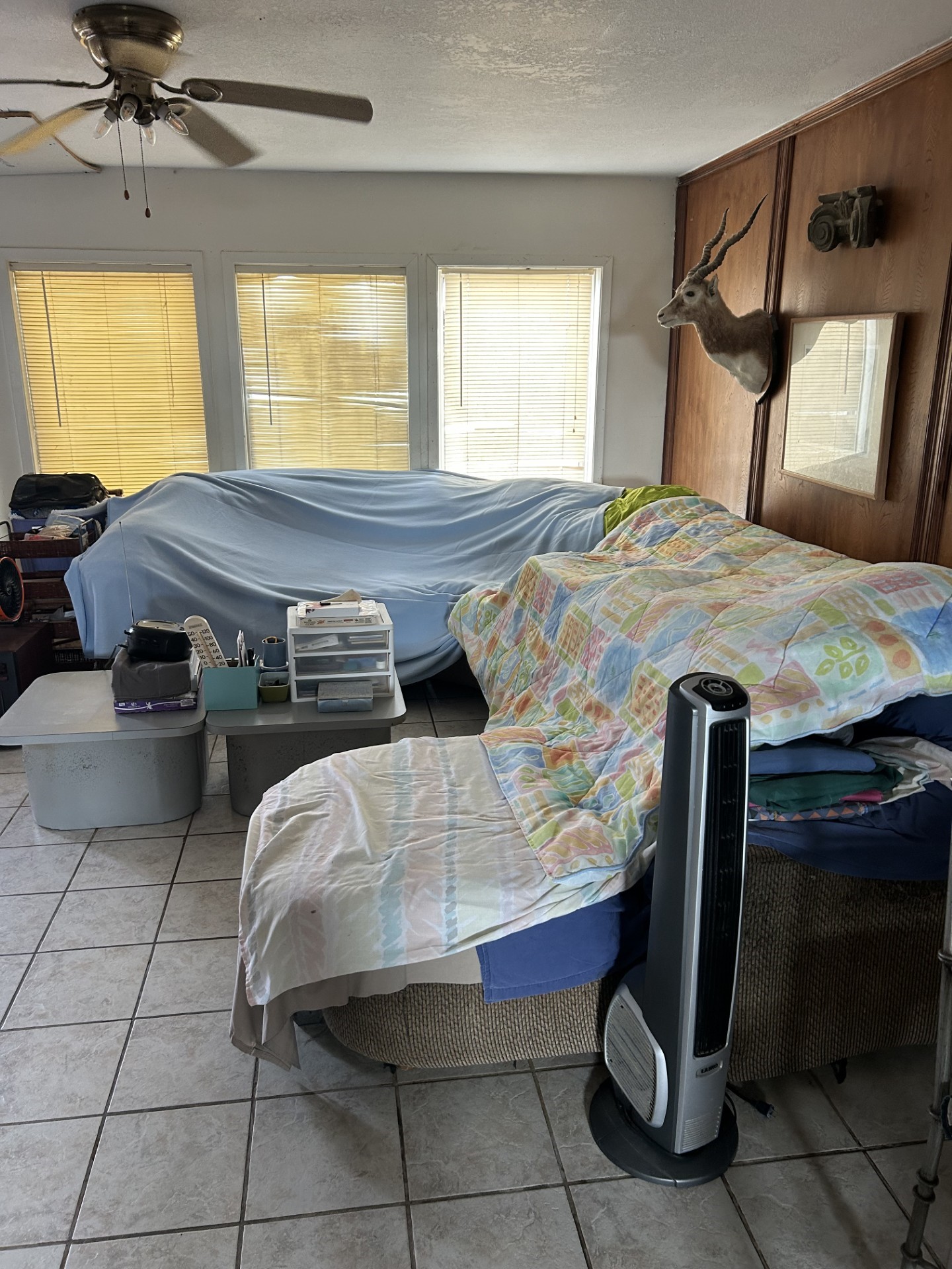 11135 Sportsman Road Galveston, TX 77554 - Photo 11 of 18 a bed sitting in a bedroom next to a window