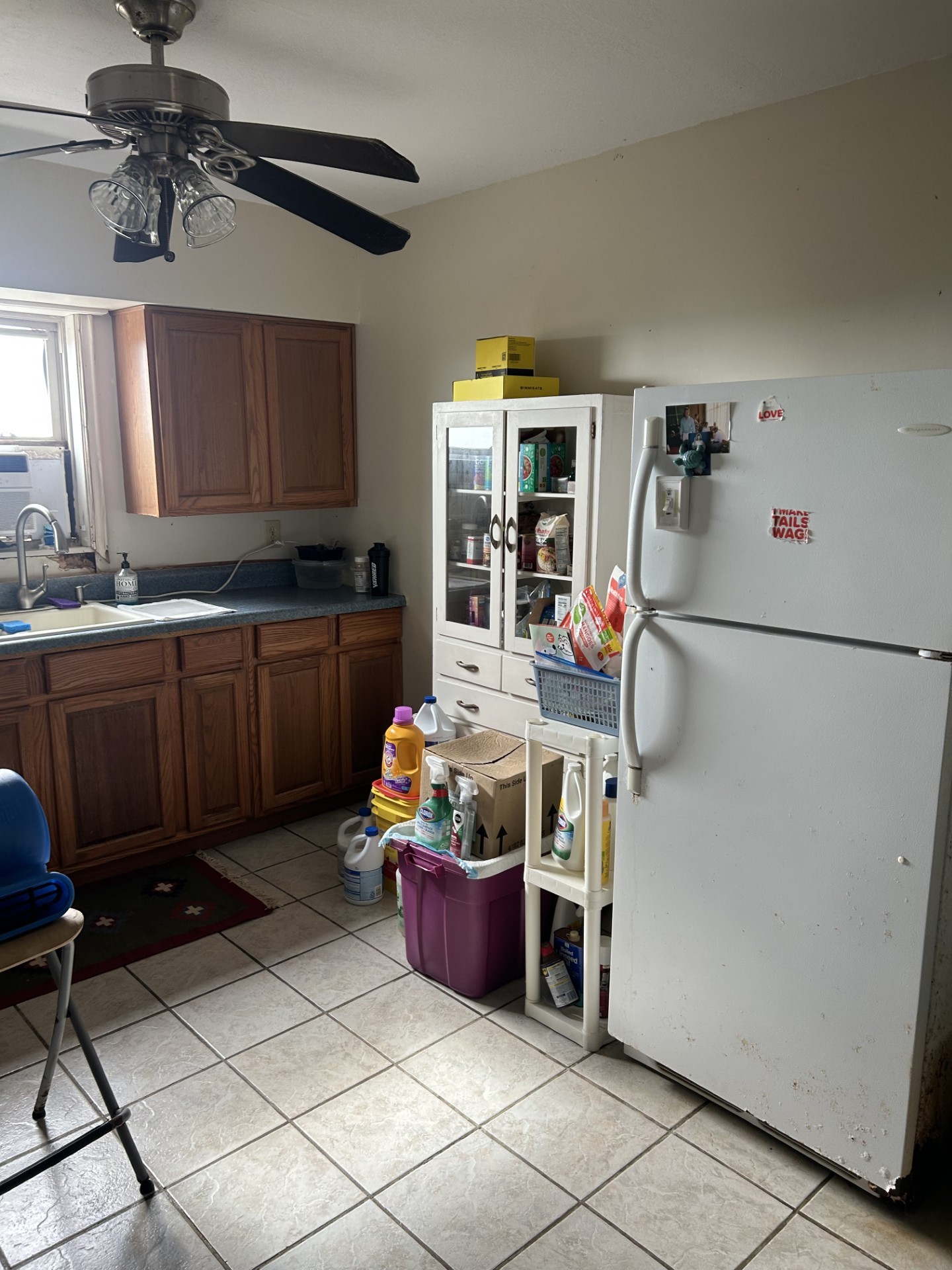 11135 Sportsman Road Galveston, TX 77554 - Photo 12 of 18 a room with stainless steel appliances kitchen island granite countertop a sink and a refrigerator
