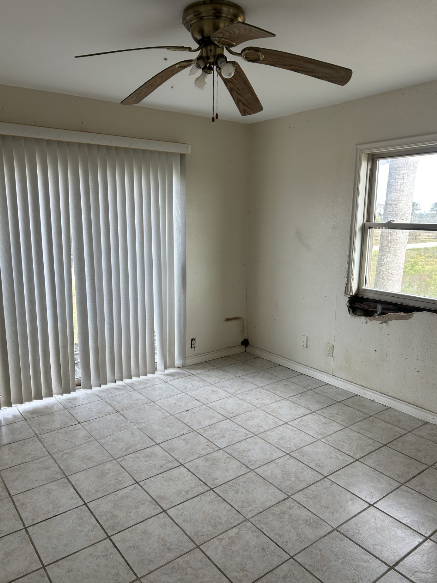 11135 Sportsman Road Galveston, TX 77554 - Photo 15 of 18 a view of a livingroom with a chandelier fan and windows