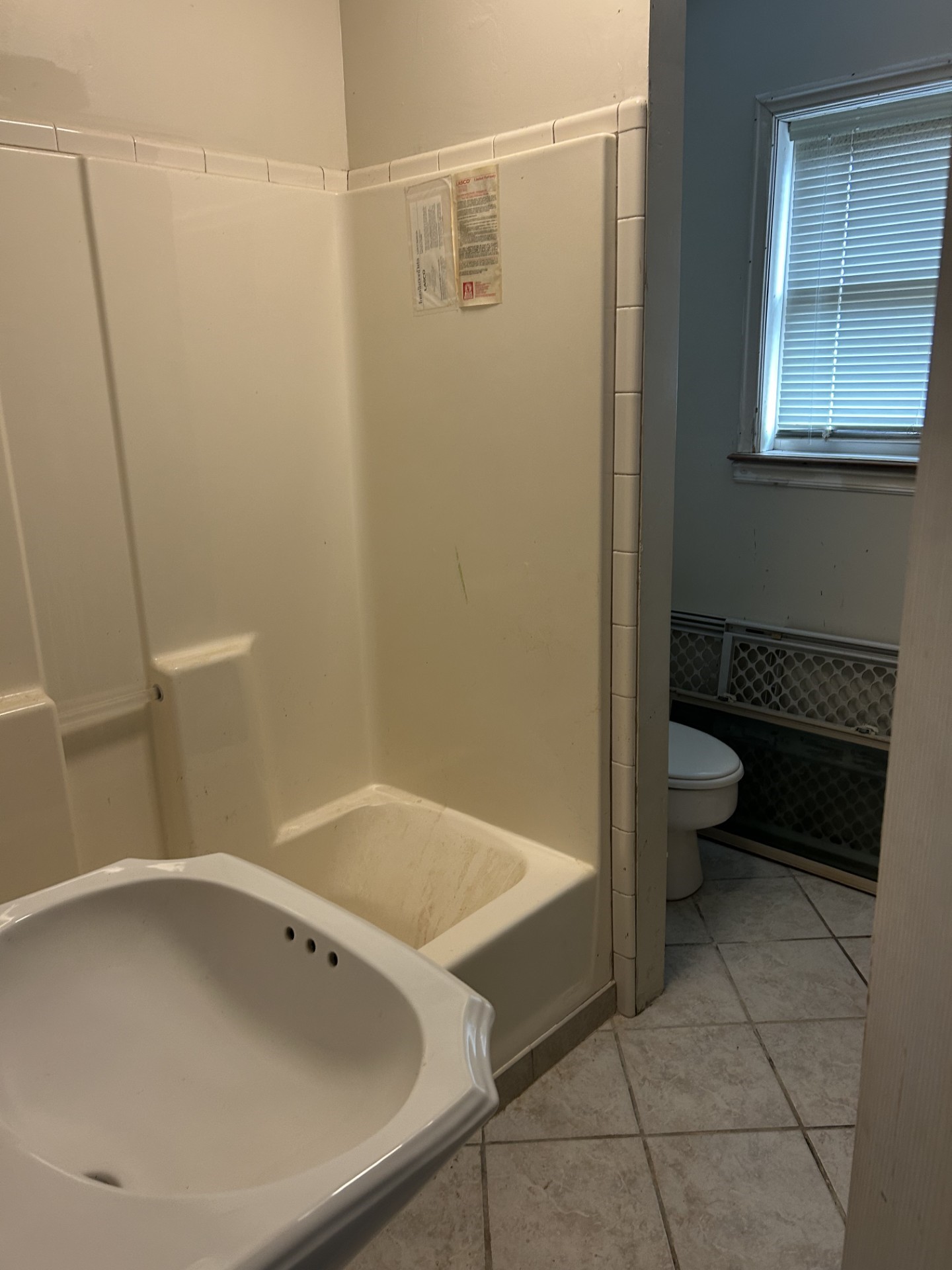 11135 Sportsman Road Galveston, TX 77554 - Photo 17 of 18 a bathroom with a sink and toilet