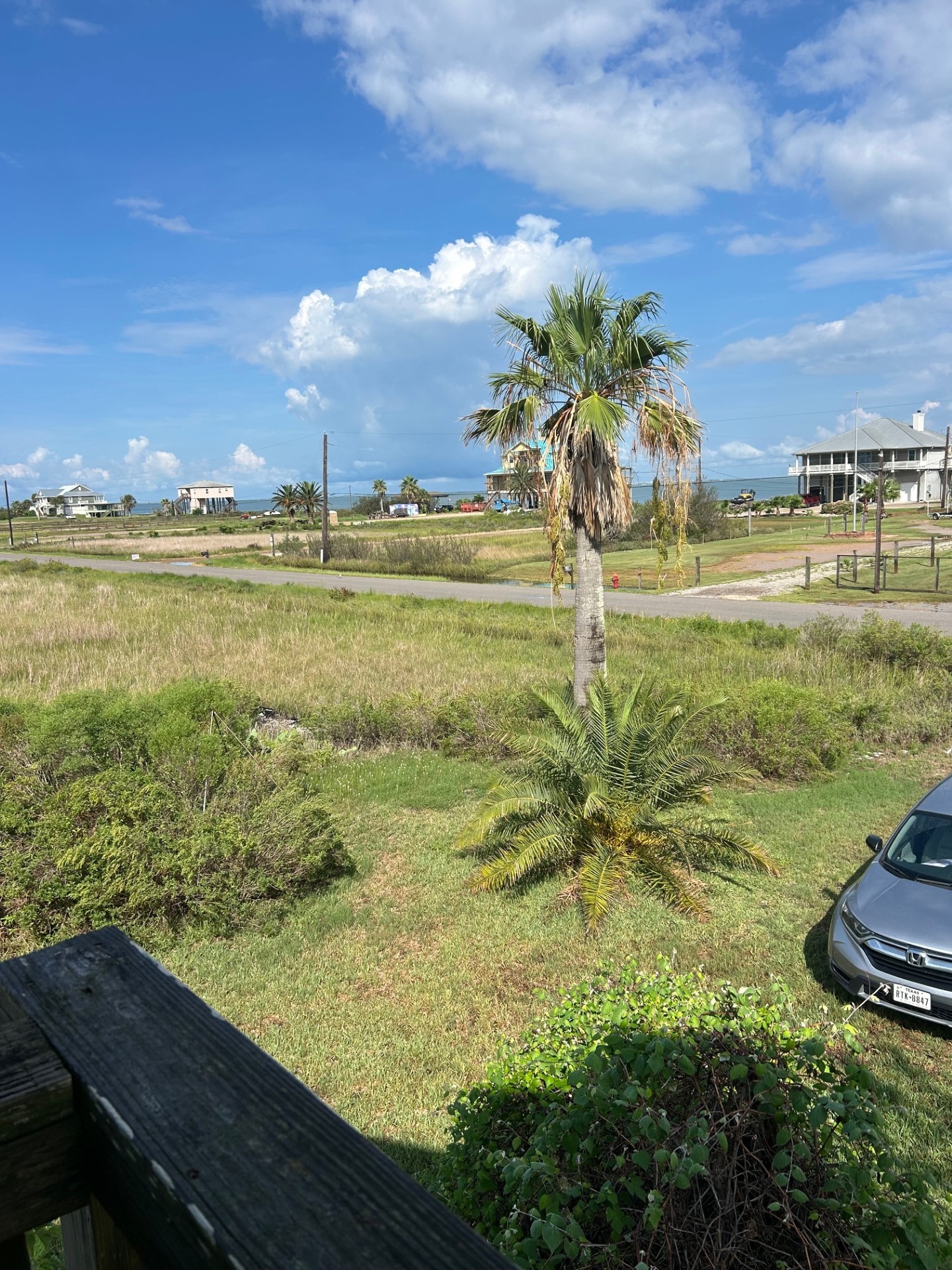 11135 Sportsman Road Galveston, TX 77554 - Photo 7 of 18 a view of a lake with a yard