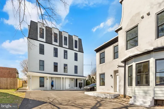 a front view of a building with a street