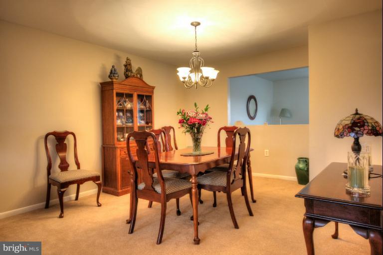 2711 Hunting Ridge Court Baldwin, MD 21013 - Photo 1 of 26 a dining room with furniture and chandelier