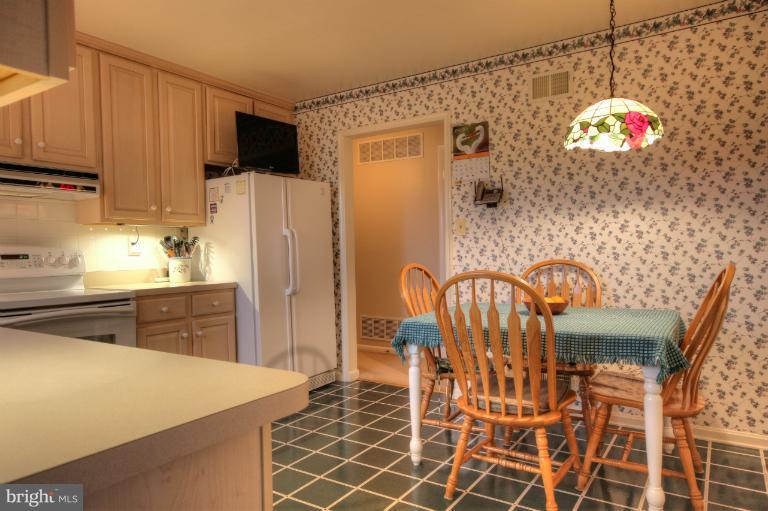 2711 Hunting Ridge Court Baldwin, MD 21013 - Photo 15 of 26 a kitchen with stainless steel appliances granite countertop a refrigerator and a stove top oven