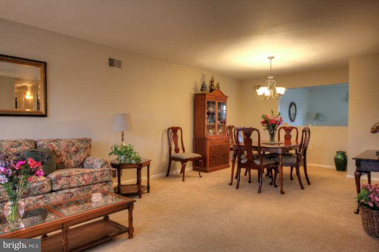 2711 Hunting Ridge Court Baldwin, MD 21013 - Photo 17 of 26 a living room with furniture and a dining room with chandelier fan