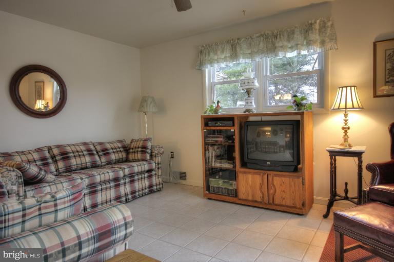 2711 Hunting Ridge Court Baldwin, MD 21013 - Photo 19 of 26 a living room with furniture a window and potted plants