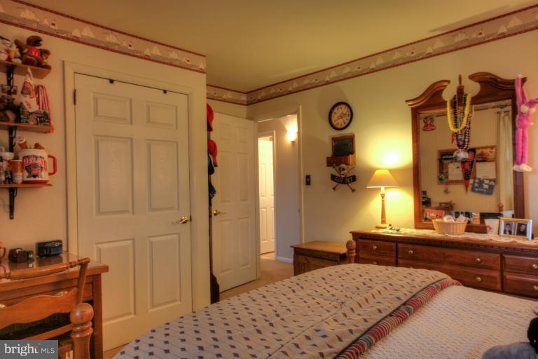 2711 Hunting Ridge Court Baldwin, MD 21013 - Photo 2 of 26 a bedroom with a bed and a dresser in it