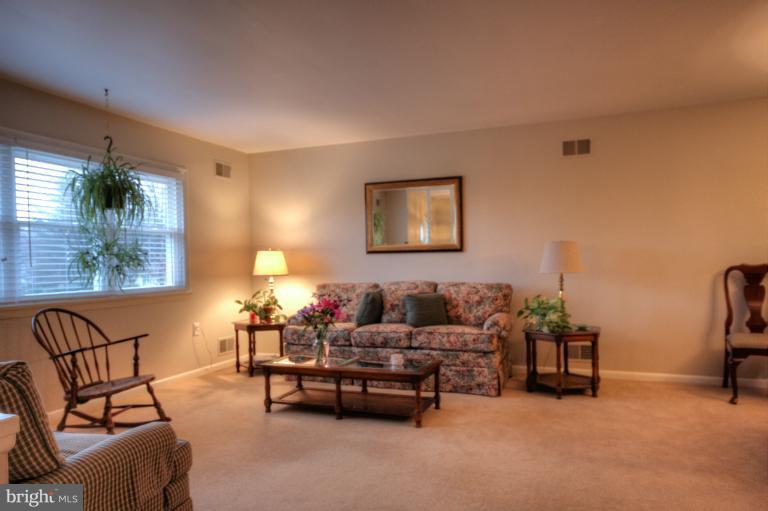 2711 Hunting Ridge Court Baldwin, MD 21013 - Photo 4 of 26 a living room with furniture and a lamp