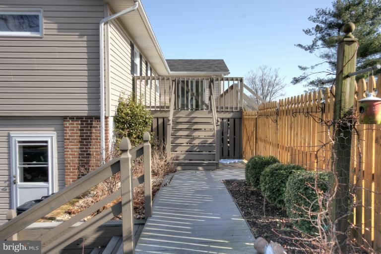 2711 Hunting Ridge Court Baldwin, MD 21013 - Photo 8 of 26 a view of a pathway with a house in the background