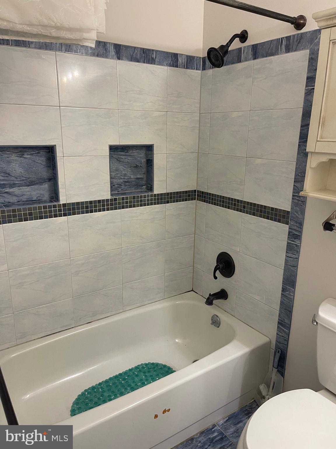 2313 Westport Lane Crofton, MD 21114 - Photo 13 of 34 a bathroom with a bathtub and a shower