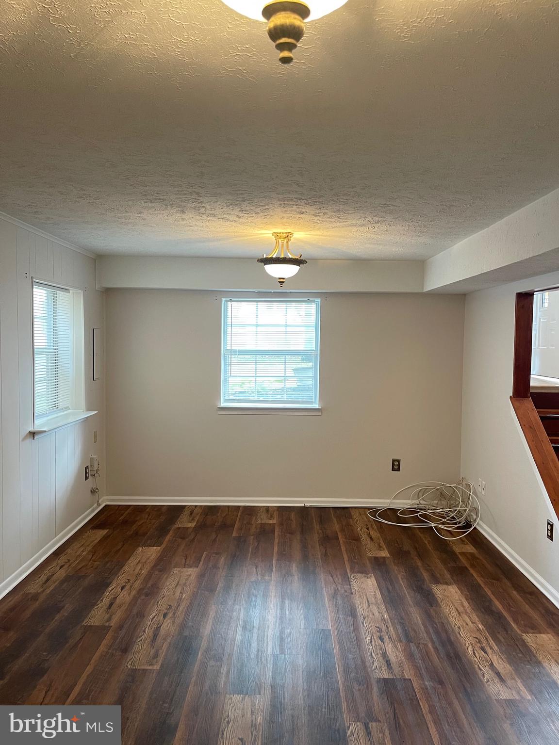 2313 Westport Lane Crofton, MD 21114 - Photo 20 of 34 an empty room with wooden floor and windows
