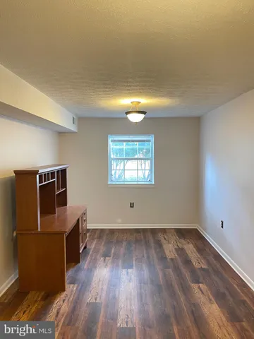 a view of a livingroom with wooden floor