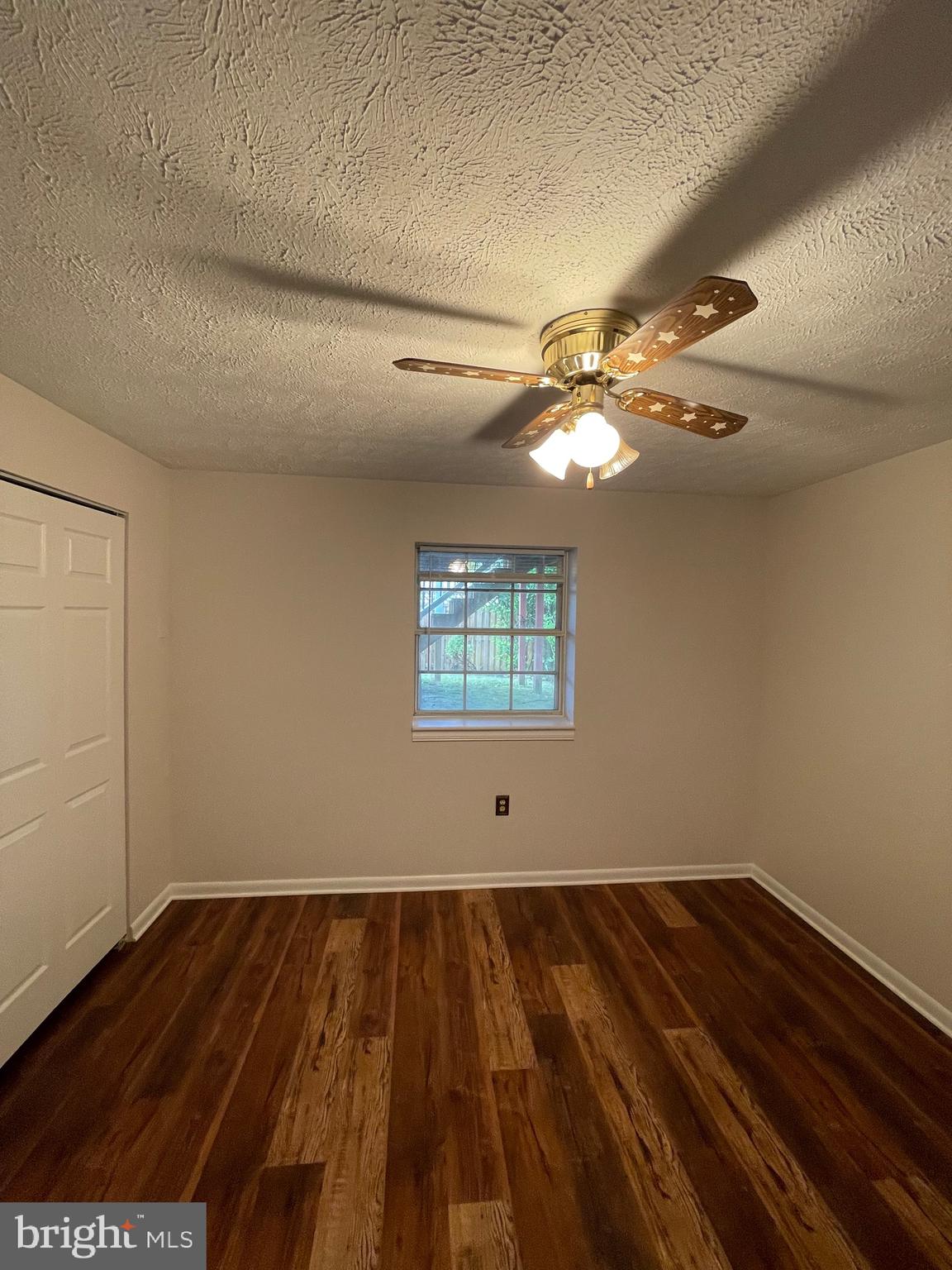 2313 Westport Lane Crofton, MD 21114 - Photo 29 of 34 a view of a room with wooden floor and fan