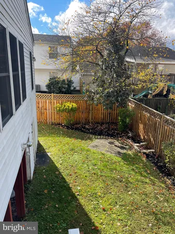 a view of a backyard with sitting area