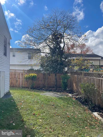 a view of a backyard with a small cabin