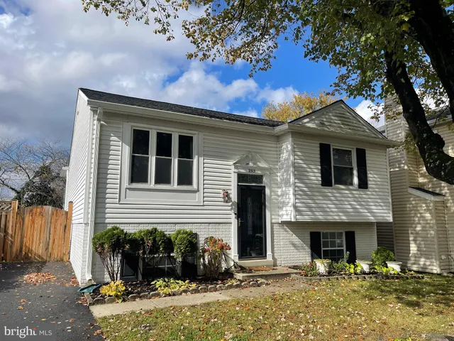 a front view of a house with yard