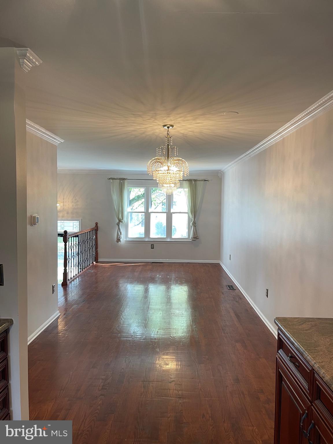 2313 Westport Lane Crofton, MD 21114 - Photo 4 of 34 an empty room with wooden floor and windows