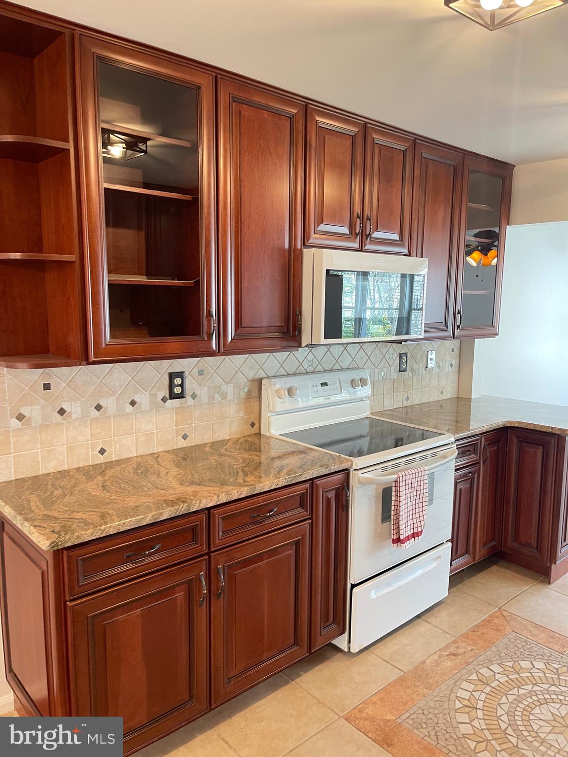 2313 Westport Lane Crofton, MD 21114 - Photo 5 of 34 a kitchen with stainless steel appliances granite countertop a sink and a stove