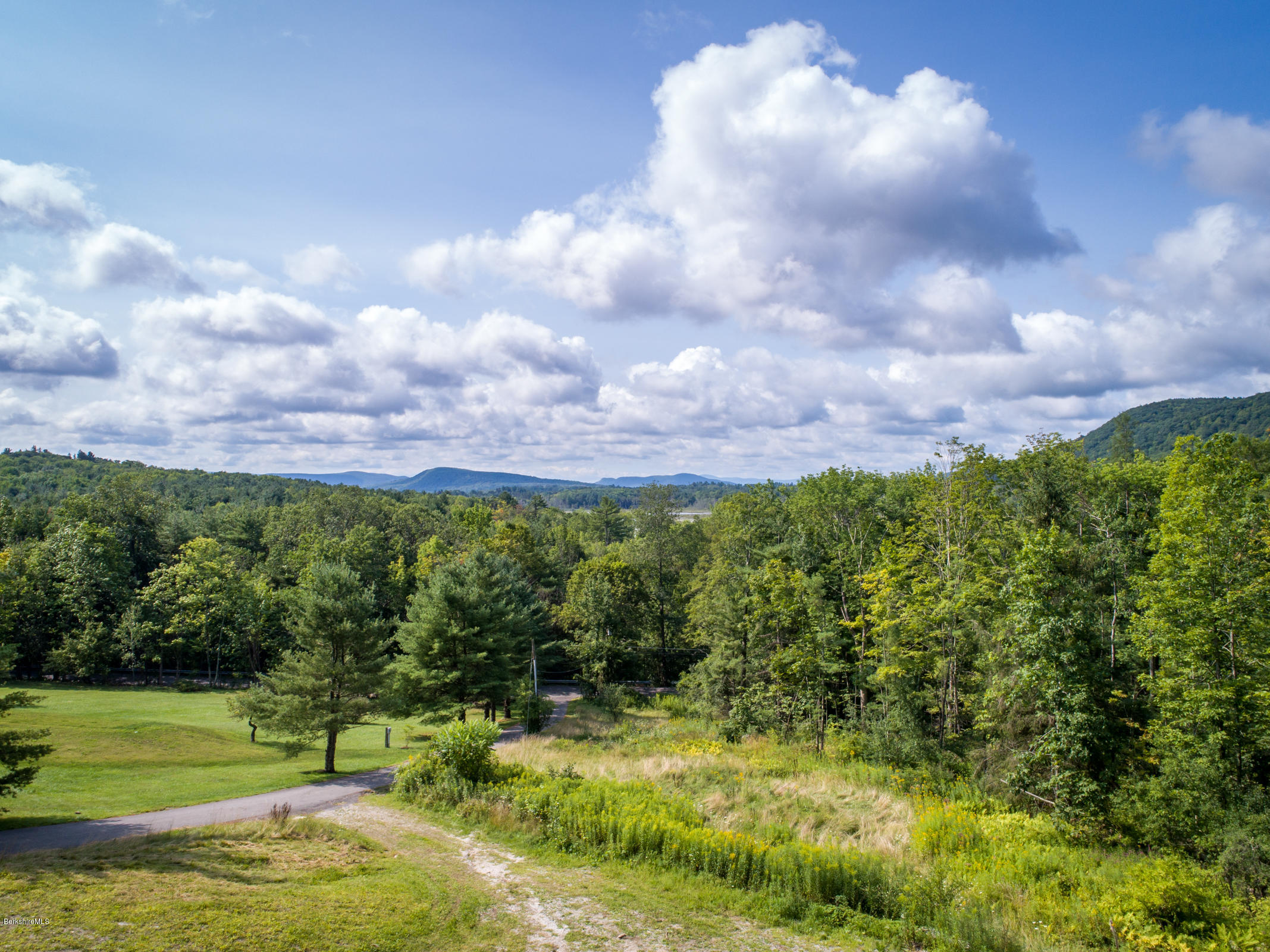 429 Under Mountain Road Lenox, MA 01240 - Photo 1 of 10 a view of a golf course with a garden