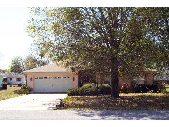 8494 Southwest 61st Terrace Road Ocala, FL 34476 - Photo 1 of 1 a view of a house with a yard